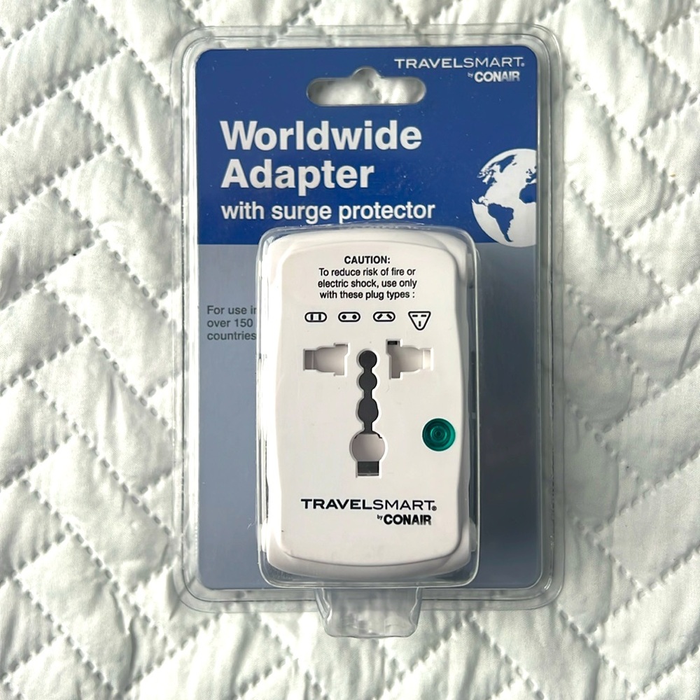 New sealed package travel smart by Conair worldwide adapter with surge protector